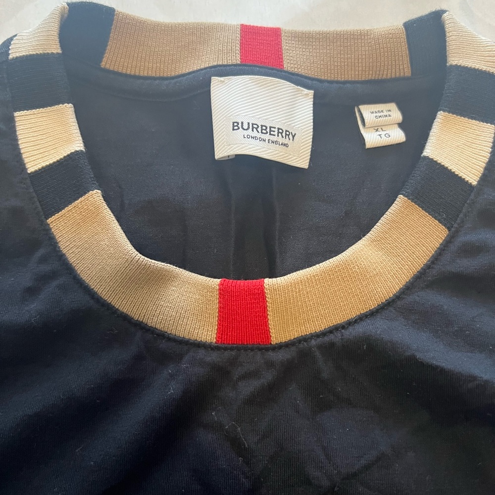 XL Burberry Tee shirt with Burberry pattern on collar.